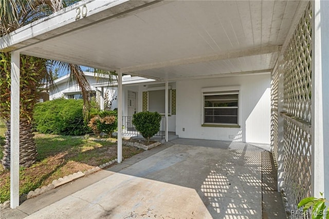 view of patio featuring an attached carport