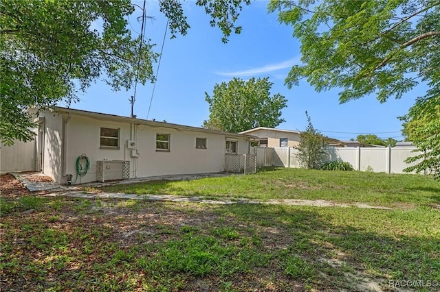 back of property with stucco siding