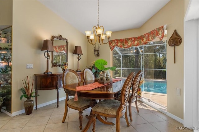 dining space featuring a notable chandelier, vaulted ceiling, baseboards, and light tile patterned floors