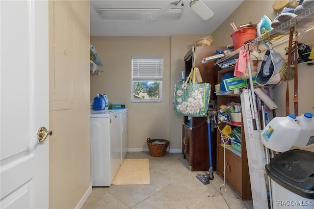 washroom featuring ceiling fan, light tile patterned flooring, laundry area, separate washer and dryer, and baseboards