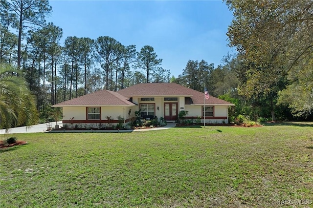 view of front of home with a front yard, french doors, and fence