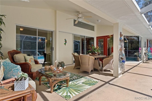 view of patio featuring outdoor dining space and ceiling fan