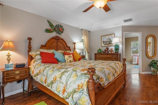 bedroom featuring baseboards, visible vents, ceiling fan, and wood finished floors