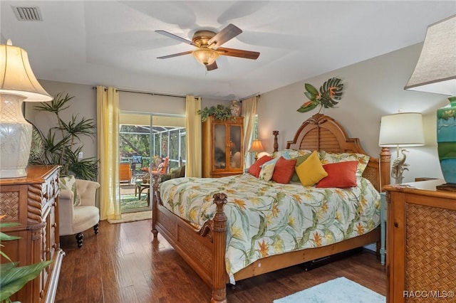 bedroom featuring ceiling fan, wood finished floors, a sunroom, visible vents, and access to outside