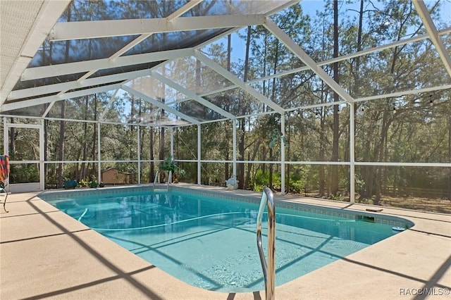 outdoor pool featuring a lanai and a patio