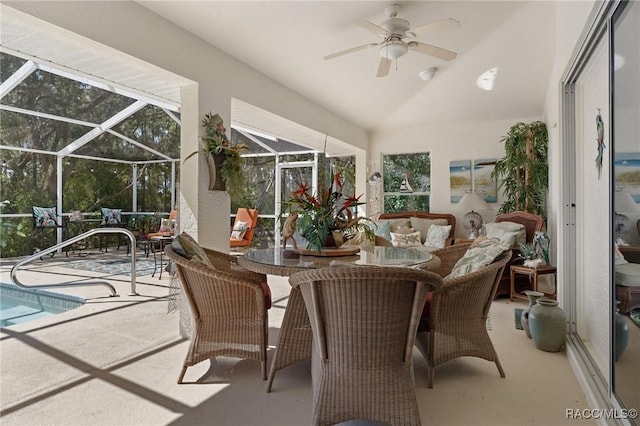 sunroom / solarium with lofted ceiling and ceiling fan