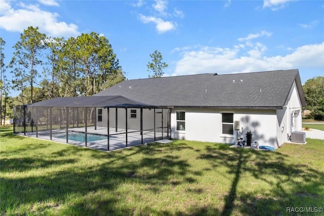 5379 N Nakoma Dr, Beverly Hills, FL 34465 - rear view of house featuring a lawn, an outdoor pool, stucco siding, a patio area, and a shingled roof