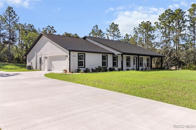 5379 N Nakoma Dr, Beverly Hills, FL 34465 - ranch-style home featuring concrete driveway, an attached garage, and a front yard