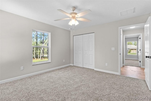 5379 N Nakoma Dr, Beverly Hills, FL 34465 - unfurnished bedroom with carpet flooring, multiple windows, a closet, and ceiling fan