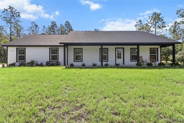 5379 N Nakoma Dr, Beverly Hills, FL 34465 - ranch-style home with covered porch, a front lawn, and roof with shingles