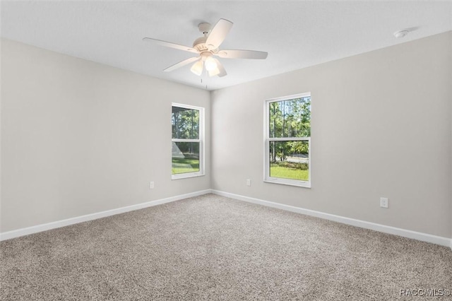 5379 N Nakoma Dr, Beverly Hills, FL 34465 - unfurnished room with healthy amount of natural light, carpet, a ceiling fan, and a smoke detector