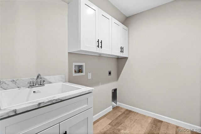 5379 N Nakoma Dr, Beverly Hills, FL 34465 - washroom featuring hookup for a washing machine, cabinet space, electric dryer hookup, and light wood-style flooring