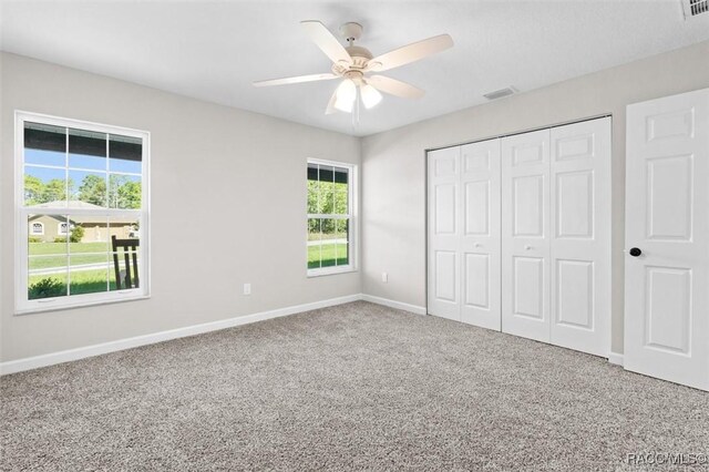 5379 N Nakoma Dr, Beverly Hills, FL 34465 - unfurnished bedroom with carpet, a closet, and ceiling fan