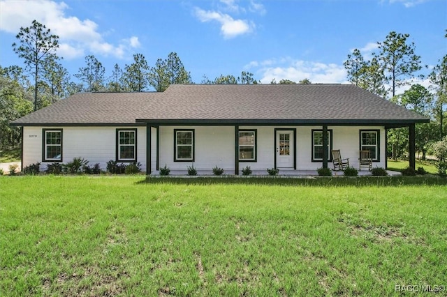 5379 N Nakoma Dr, Beverly Hills, FL 34465 - single story home with covered porch, a front yard, and roof with shingles