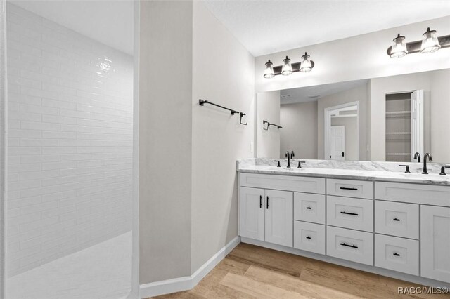 5379 N Nakoma Dr, Beverly Hills, FL 34465 - bathroom with double vanity, wood finished floors, and walk in shower