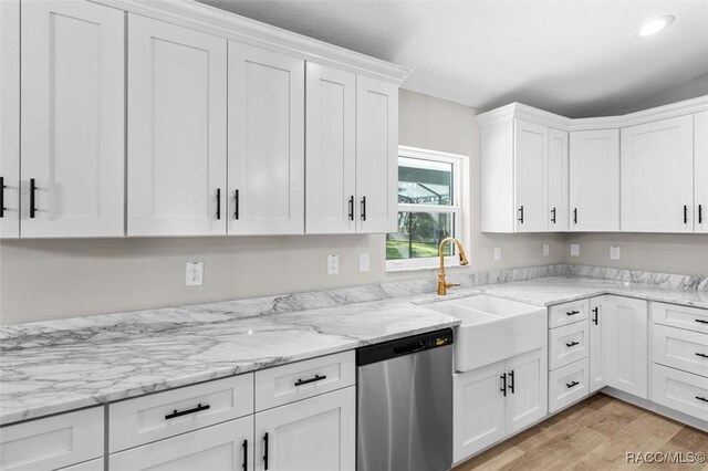 5379 N Nakoma Dr, Beverly Hills, FL 34465 - kitchen with stainless steel dishwasher, white cabinetry, light wood finished floors, light stone countertops, and recessed lighting