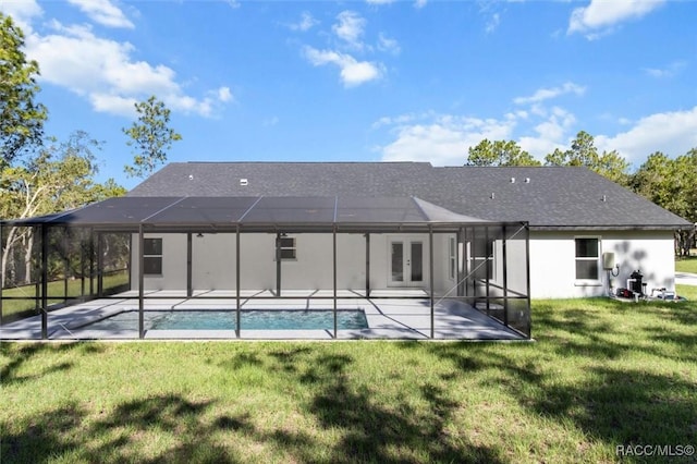 5379 N Nakoma Dr, Beverly Hills, FL 34465 - back of house with french doors, a patio area, a lawn, and an outdoor pool