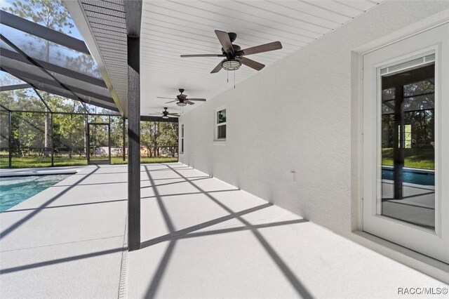 5379 N Nakoma Dr, Beverly Hills, FL 34465 - view of patio / terrace with a ceiling fan, an outdoor pool, and a lanai