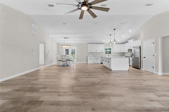 5379 N Nakoma Dr, Beverly Hills, FL 34465 - unfurnished living room with ceiling fan, light wood-type flooring, recessed lighting, and high vaulted ceiling