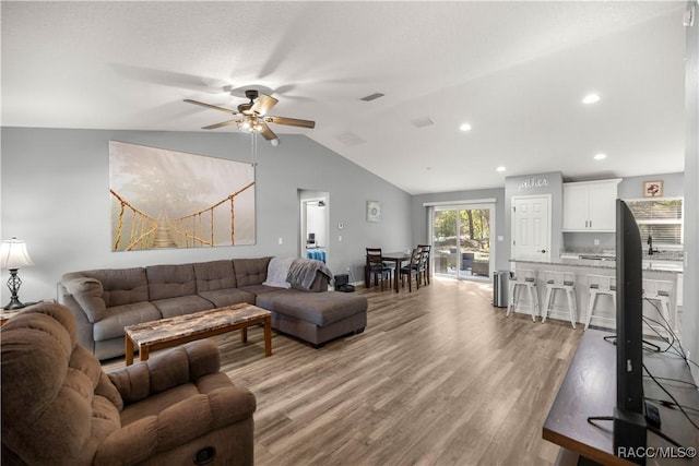 13458 SW 113th Pl, Dunnellon, FL 34432 - living area with light wood-style flooring, visible vents, recessed lighting, vaulted ceiling, and a ceiling fan