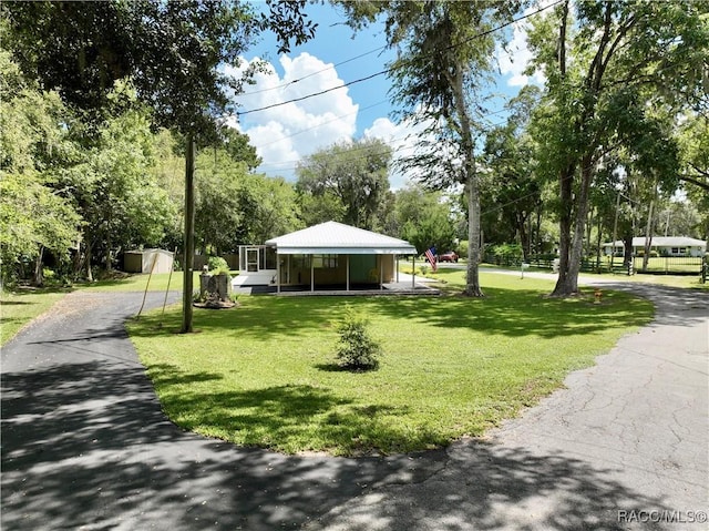 surrounding community with a yard