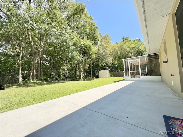 view of patio with an outdoor structure and a storage shed