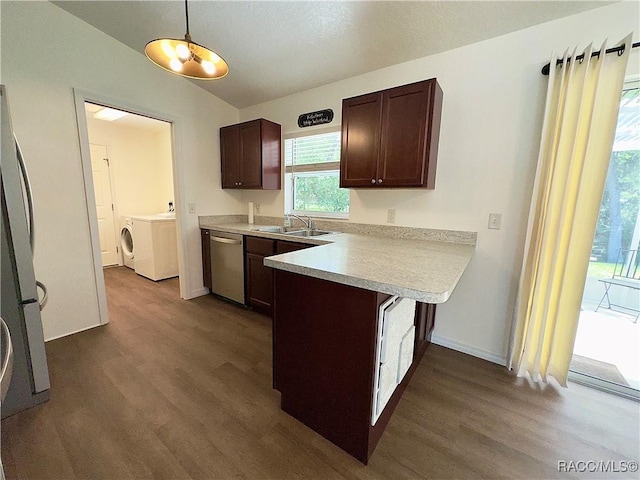 kitchen with stainless steel dishwasher, freestanding refrigerator, dark wood-style flooring, a peninsula, and a sink