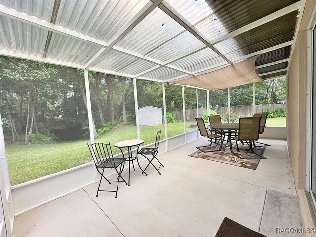 sunroom with outdoor dining area