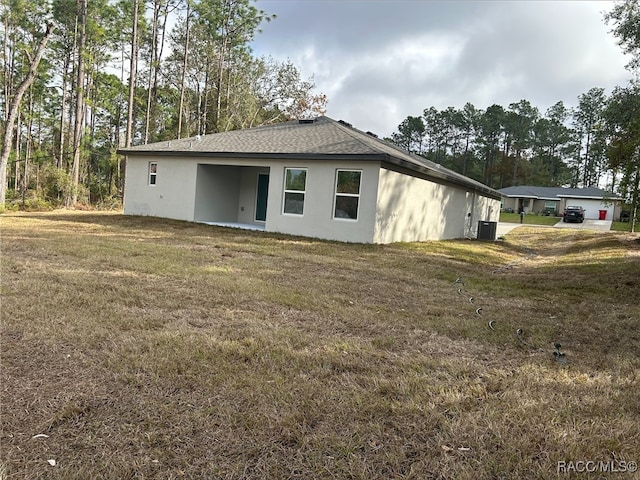 view of side of property with a yard