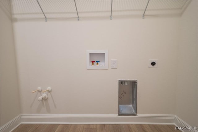 laundry room featuring gas dryer hookup, hardwood / wood-style floors, washer hookup, and hookup for an electric dryer