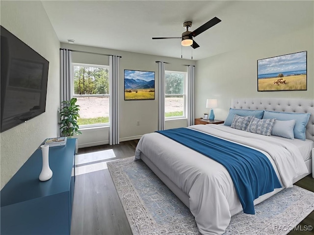1370 SW Obee Ridge Rd, Dunnellon, FL 34430 - bedroom featuring wood finished floors and ceiling fan