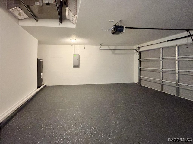 1370 SW Obee Ridge Rd, Dunnellon, FL 34430 - garage featuring a garage door opener, concrete block wall, and electric panel