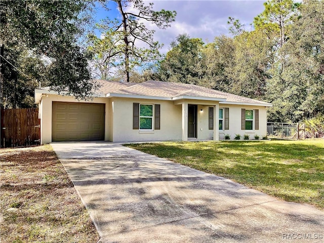 ranch-style home with a front yard and a garage