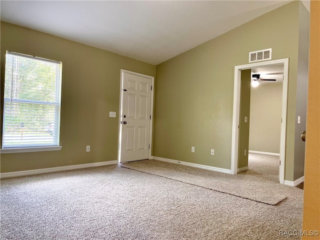 unfurnished room featuring carpet flooring, ceiling fan, and lofted ceiling