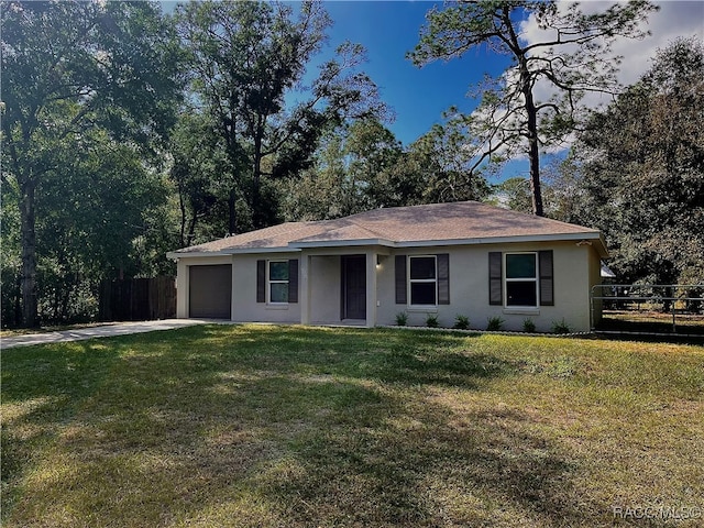 single story home with a garage and a front lawn