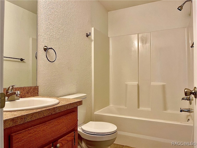 full bathroom featuring vanity, shower / bath combination, and toilet