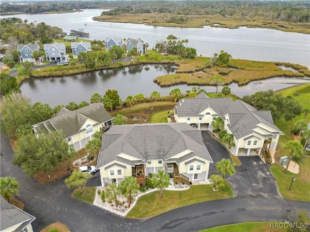 birds eye view of property featuring a water view and a residential view