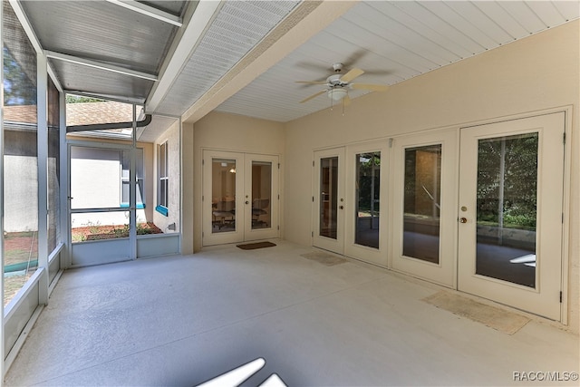 unfurnished sunroom with french doors and ceiling fan