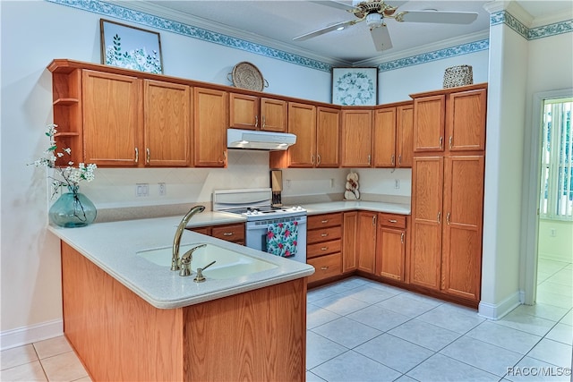 kitchen featuring kitchen peninsula, white range oven, ceiling fan, crown molding, and light tile patterned floors