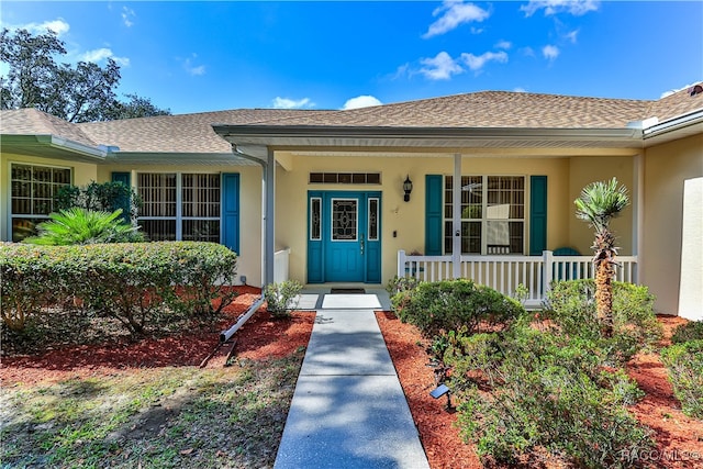 doorway to property with covered porch