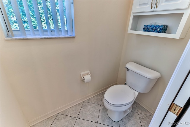 bathroom with tile patterned floors and toilet