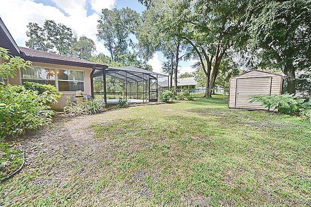 view of yard featuring a lanai and a shed