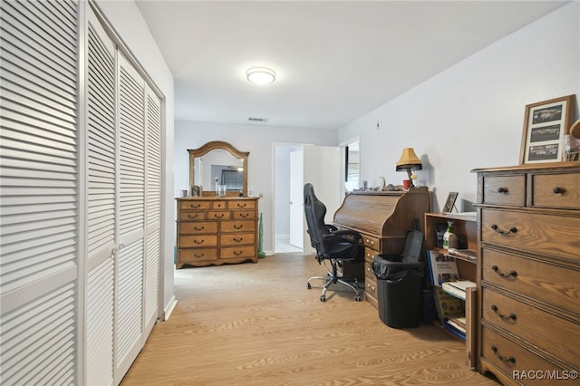 office area with light hardwood / wood-style floors