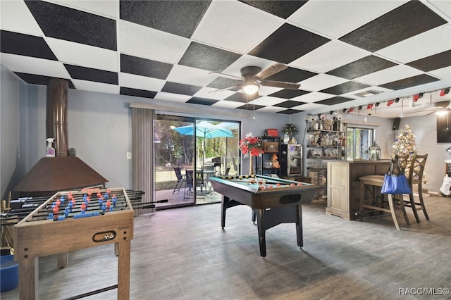 rec room featuring pool table, ceiling fan, dark hardwood / wood-style flooring, and bar