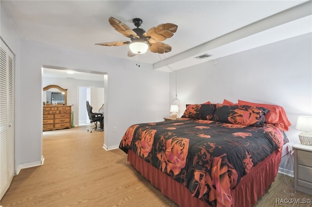 bedroom with a closet, ceiling fan, and light hardwood / wood-style floors