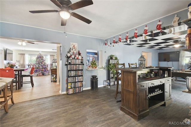 kitchen featuring a kitchen bar, dark hardwood / wood-style flooring, and a kitchen island