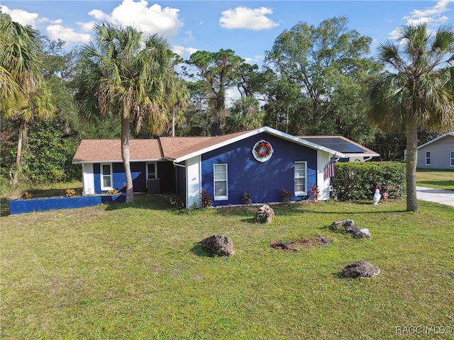 ranch-style house featuring a front lawn