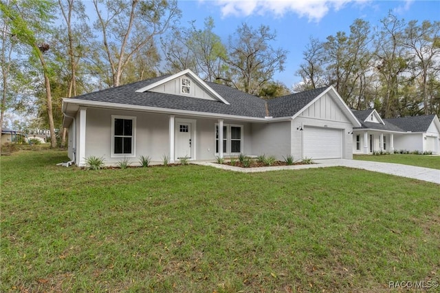 4911 S Skyblue Dr, Inverness, FL 34452 - view of front of property featuring concrete driveway, a front lawn, board and batten siding, and an attached garage