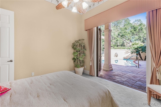 carpeted bedroom featuring ceiling fan and access to outside