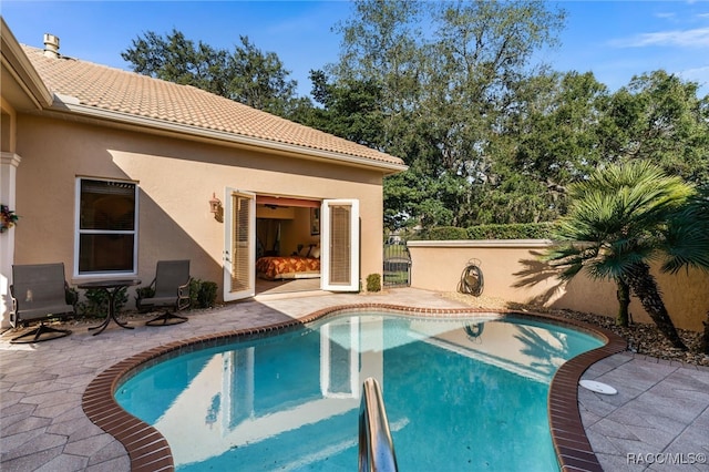 view of swimming pool with a patio